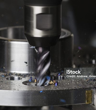 A hole is milled in a flange on a CNC machining center using a carbide endmill